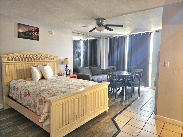 1233 S Atlantic Ave Unit 5270, Daytona Beach, FL 32118 - bedroom with baseboards, ceiling fan, and a textured ceiling