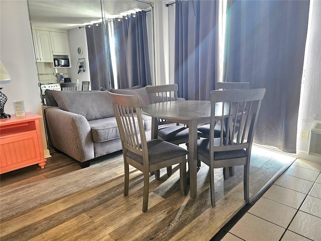 dining area with hardwood / wood-style floors