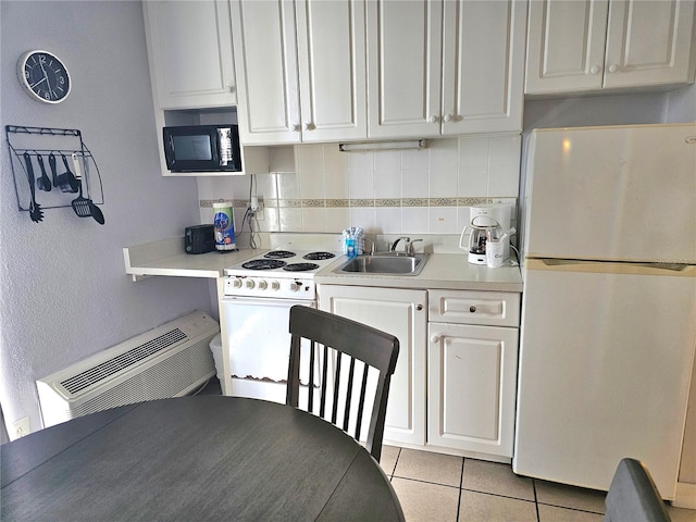 kitchen featuring sink, white cabinets, backsplash, white appliances, and light tile patterned floors