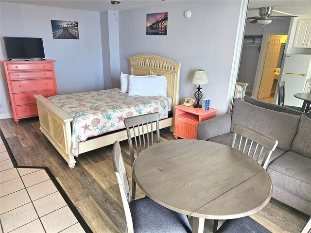 1233 S Atlantic Ave Unit 5270, Daytona Beach, FL 32118 - bedroom featuring freestanding refrigerator and wood finished floors