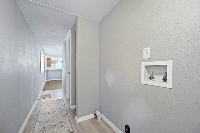 corridor featuring light hardwood / wood-style flooring