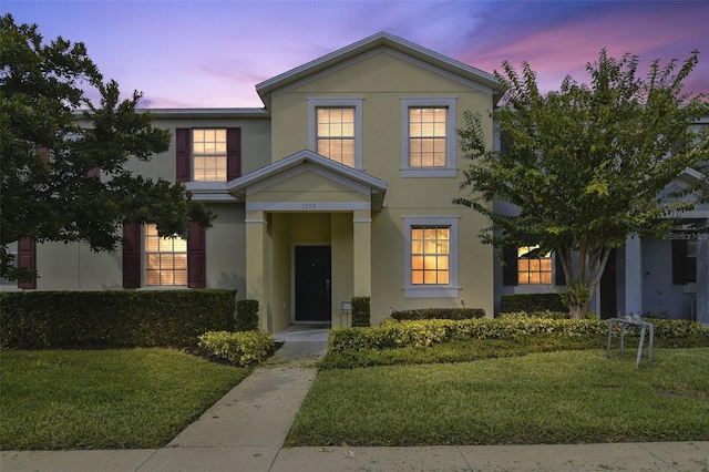 view of front of property with a yard