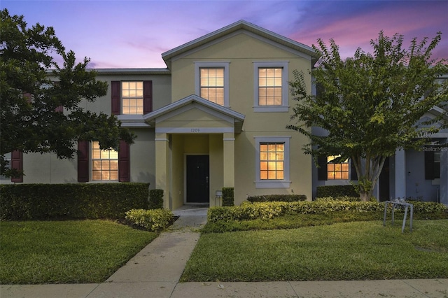 1209 Seburn Rd, Apopka, FL 32703 - view of front facade with stucco siding and a yard