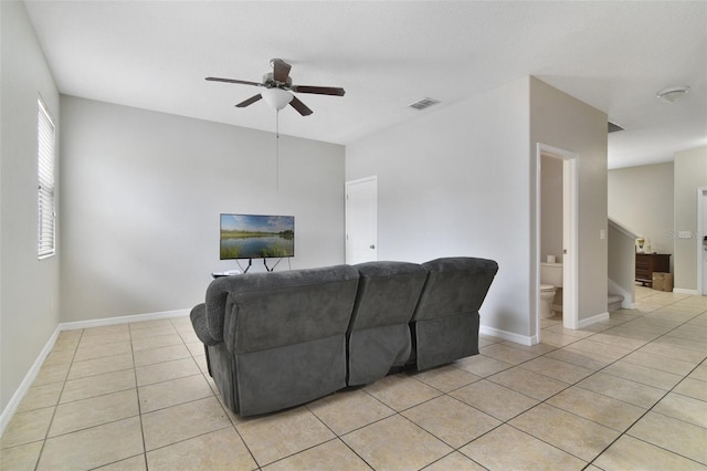 1209 Seburn Rd, Apopka, FL 32703 - living room featuring a ceiling fan, light tile patterned floors, and stairway