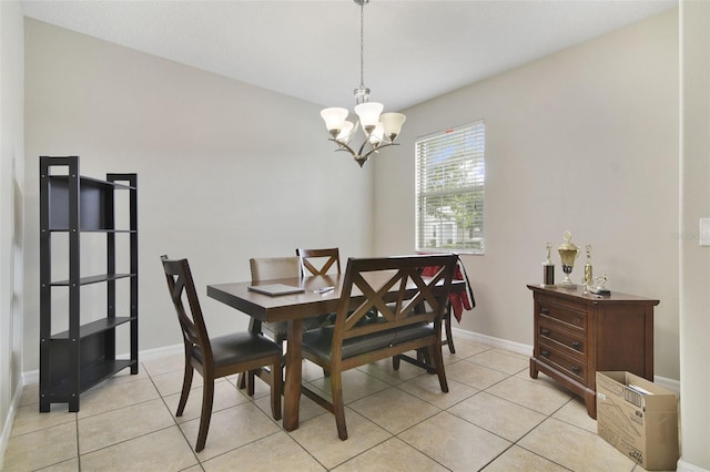 tiled dining space with a notable chandelier