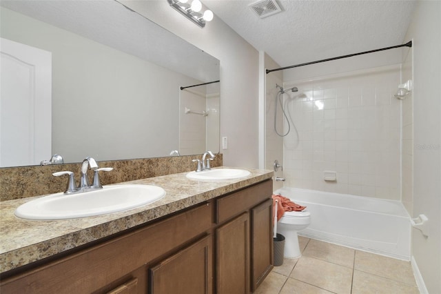 1209 Seburn Rd, Apopka, FL 32703 - bathroom featuring tile patterned flooring, washtub / shower combination, double vanity, and a textured ceiling