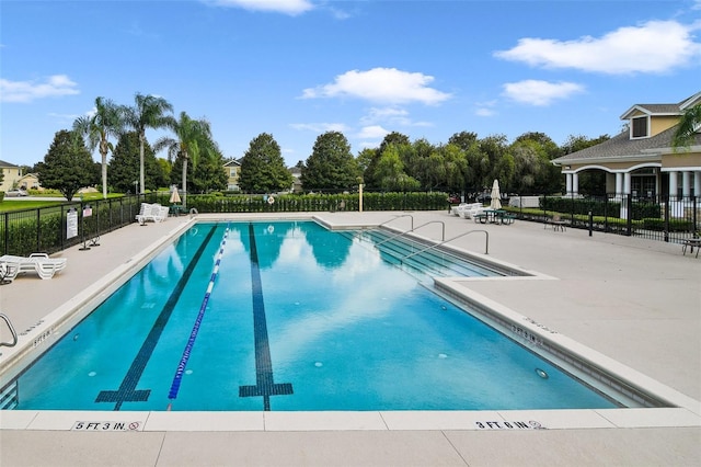 view of swimming pool featuring a patio