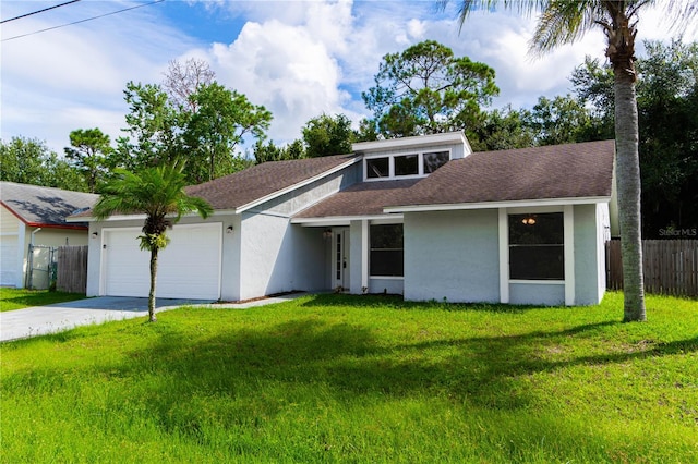 ranch-style house featuring a front lawn and a garage