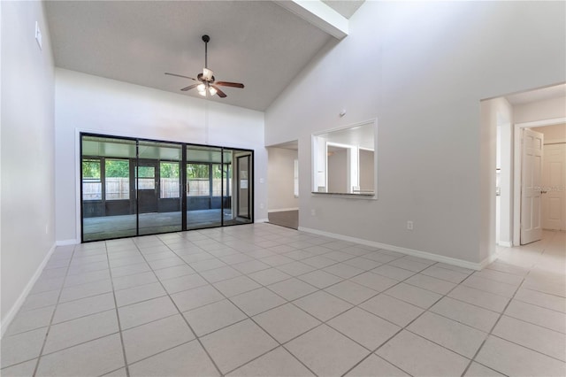 interior space with light tile patterned flooring, beam ceiling, high vaulted ceiling, and ceiling fan