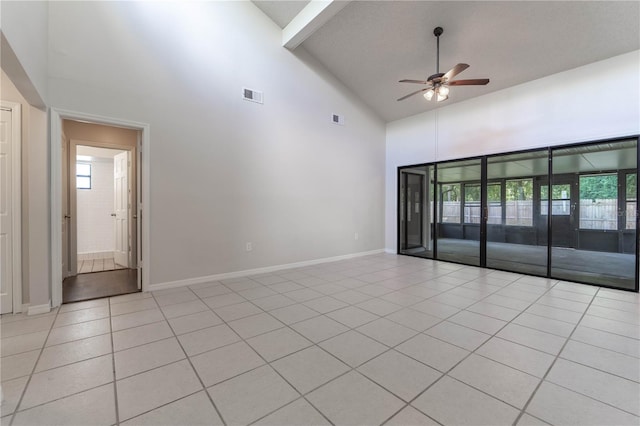 tiled spare room with beam ceiling, high vaulted ceiling, and ceiling fan