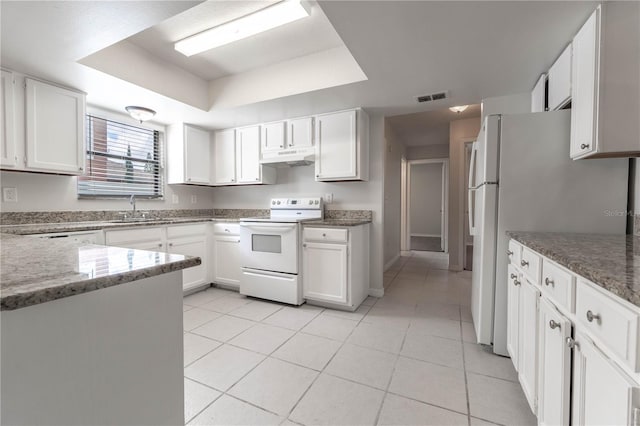 kitchen featuring light tile patterned flooring, white cabinets, sink, and white appliances