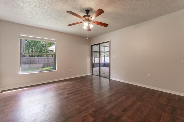 spare room with dark wood-type flooring, ceiling fan, and a textured ceiling