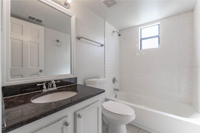 full bathroom with vanity, toilet, tiled shower / bath combo, and tile patterned flooring