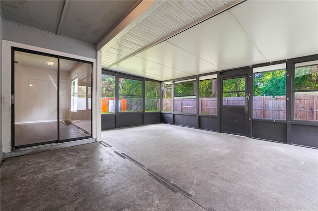 unfurnished sunroom featuring a healthy amount of sunlight