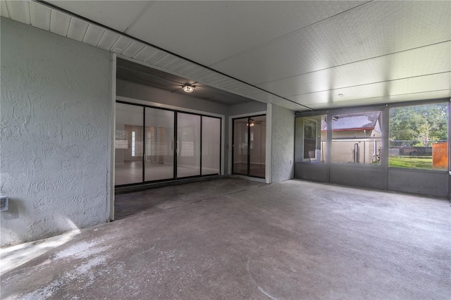 unfurnished room featuring concrete floors