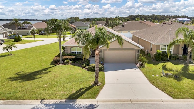 view of front of property with a garage and a front lawn