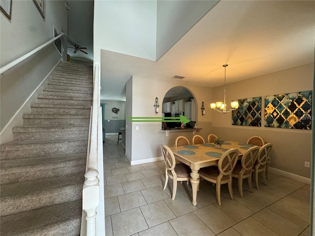 dining area with stairway, visible vents, tile patterned flooring, and baseboards