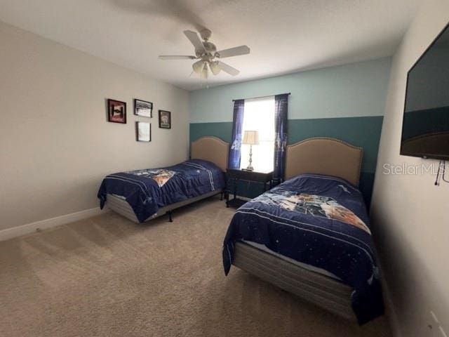 bedroom featuring a ceiling fan and carpet floors