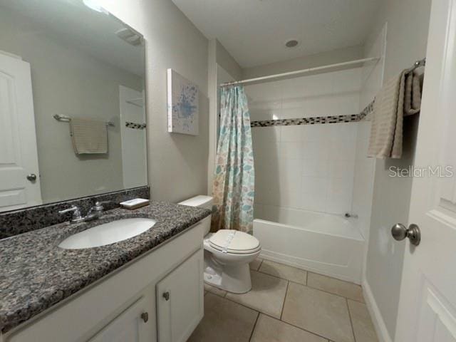 full bathroom with shower / bath combination with curtain, vanity, toilet, and tile patterned floors