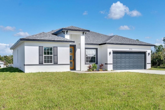 prairie-style home with a front yard and a garage