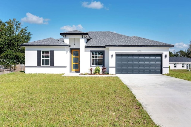 prairie-style house with a front lawn and a garage