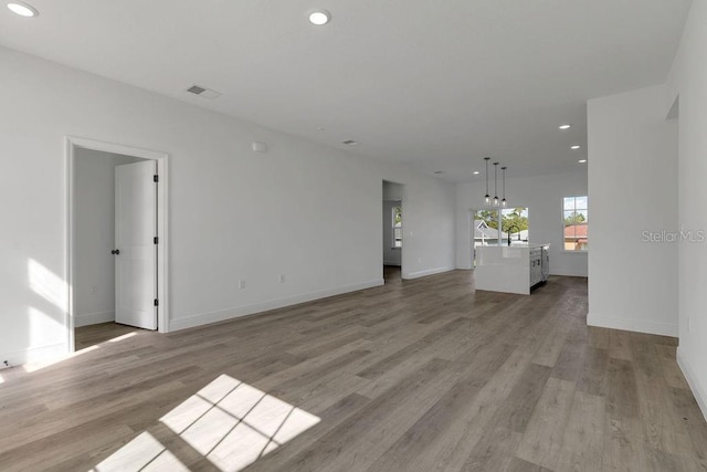 unfurnished living room featuring light wood-type flooring