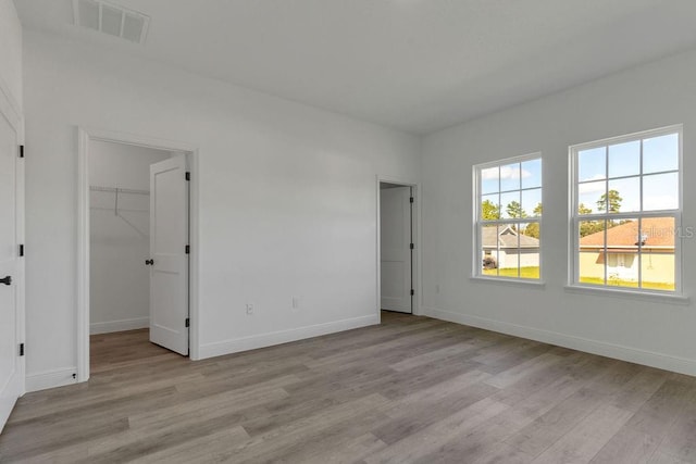 spare room featuring light hardwood / wood-style flooring