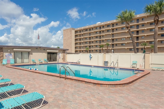 view of swimming pool featuring a patio