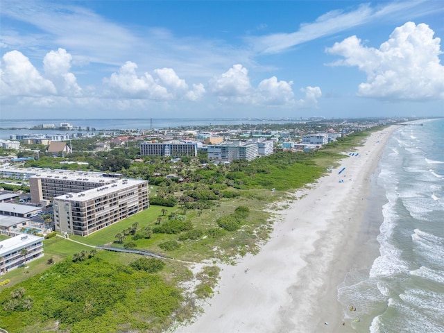 aerial view featuring a water view and a view of the beach