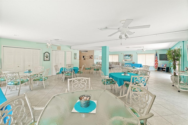 tiled dining room featuring ceiling fan