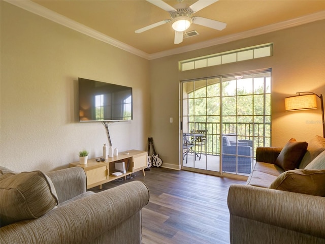 living room featuring ornamental molding, wood-type flooring, and ceiling fan