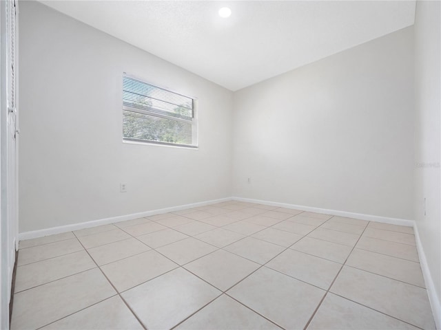 spare room featuring light tile patterned floors