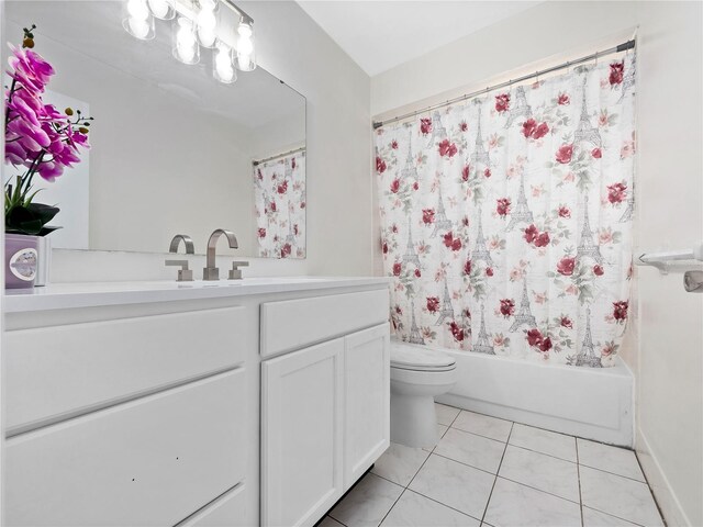 full bathroom featuring vanity, tile patterned flooring, toilet, and shower / tub combo with curtain