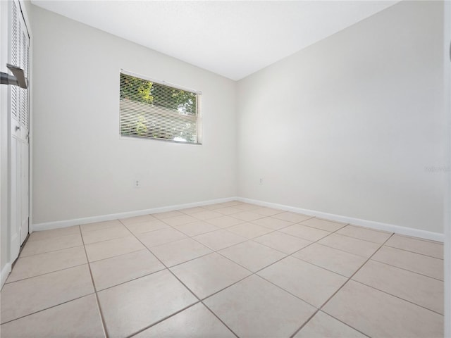 5400 Fox Briar Trl, Orlando, FL 32808 - unfurnished bedroom featuring light tile patterned flooring and baseboards
