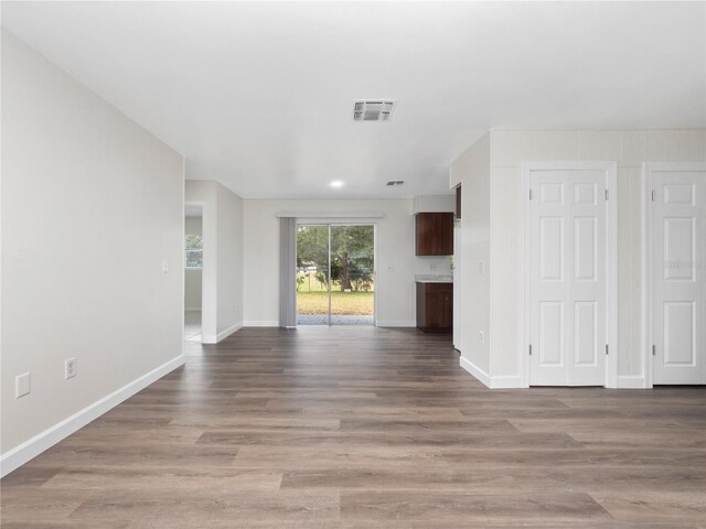 unfurnished living room featuring light hardwood / wood-style flooring