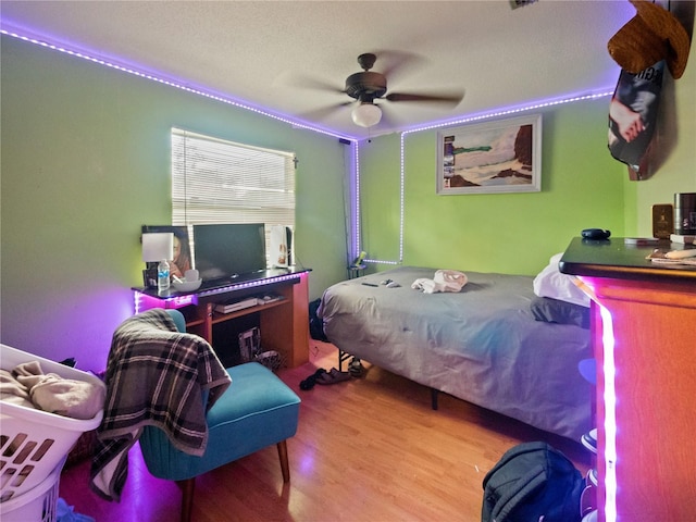 bedroom featuring ceiling fan and wood-type flooring