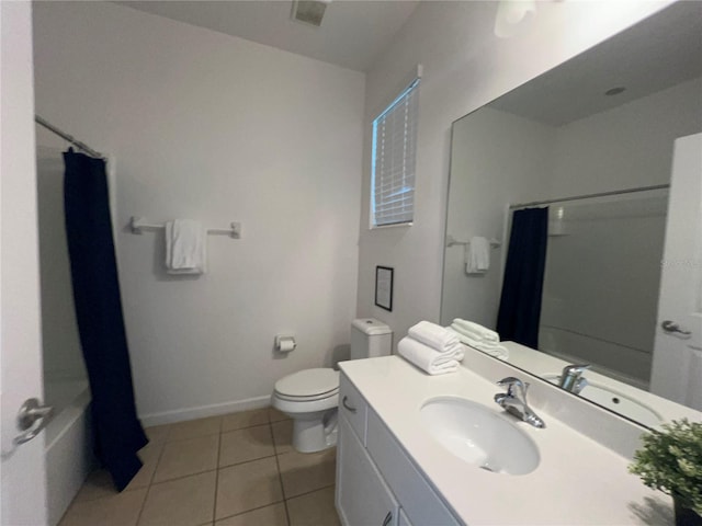 full bathroom with tile patterned floors, vanity, toilet, and shower / bath combination with curtain