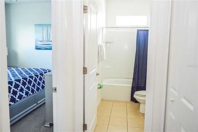 bathroom with toilet, shower / tub combo, and tile patterned flooring