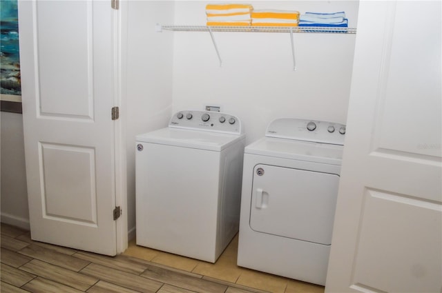 laundry area with washing machine and clothes dryer