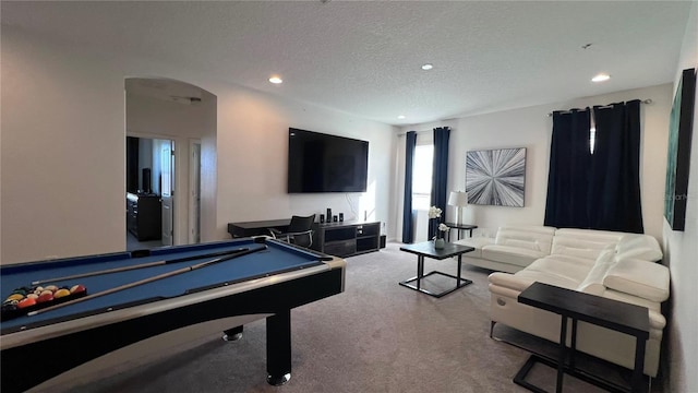 playroom featuring a textured ceiling, pool table, and carpet flooring