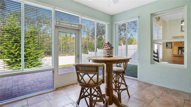 sunroom / solarium with ceiling fan