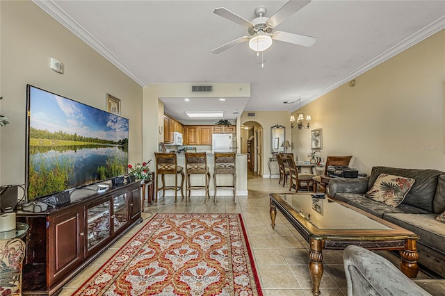 tiled living room featuring ceiling fan with notable chandelier and crown molding