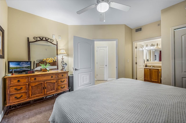 bedroom with carpet floors, sink, connected bathroom, and ceiling fan