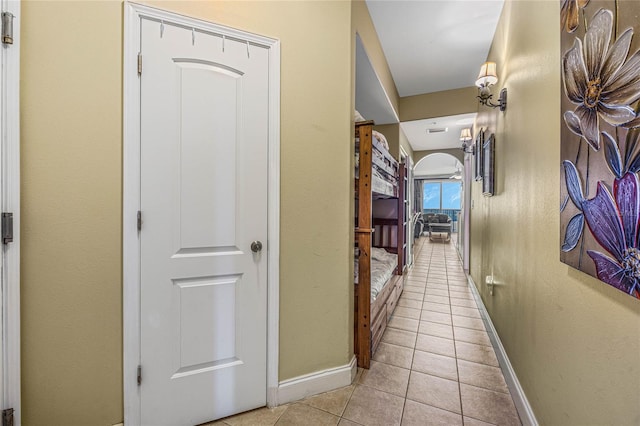 hallway featuring light tile patterned floors