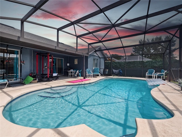 view of pool at dusk