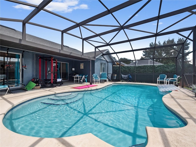 view of pool featuring a lanai and a patio area