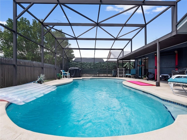 view of pool with a lanai and a patio