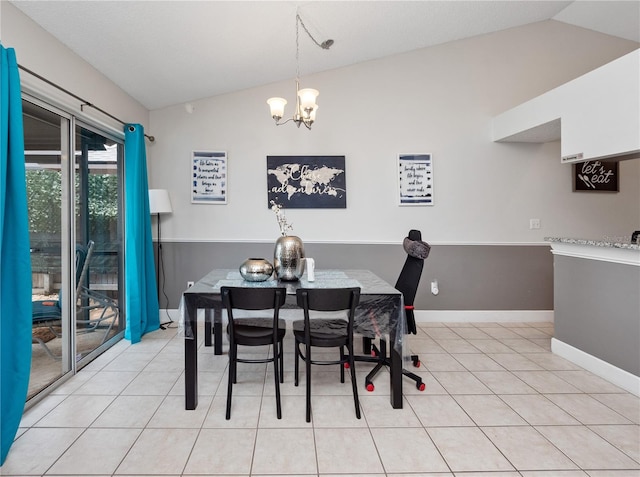 dining space with light tile patterned floors, a chandelier, and vaulted ceiling