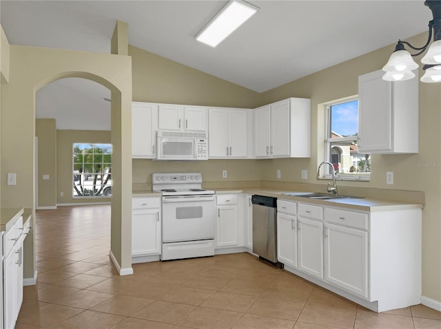 kitchen with white cabinetry, white appliances, lofted ceiling, decorative light fixtures, and sink