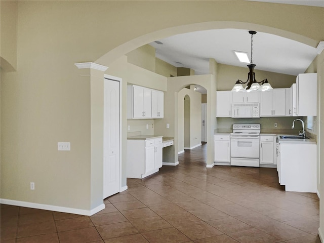 kitchen featuring hanging light fixtures, white cabinets, white appliances, an inviting chandelier, and sink